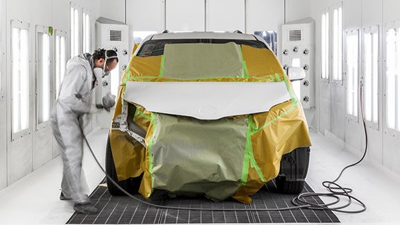 Collision Center Technician Painting a Vehicle | Performance Toyota in Sinking Spring PA